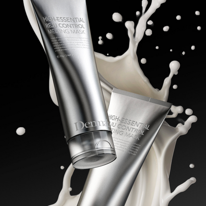 Two silver tubes of Dermabell High-Essential Reju Control Melting Mask with white liquid splashes on a black background.