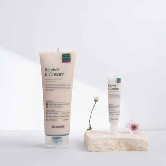 A tube and a jar of Revive K Cream with a white background. The packaging is in shades of beige and white with text and branding visible.